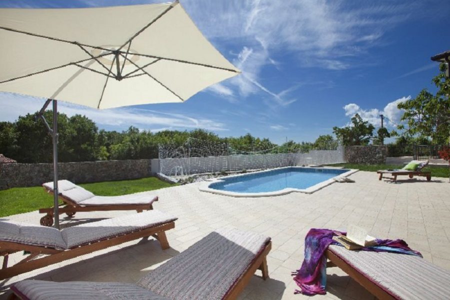 Pool with sun lounges